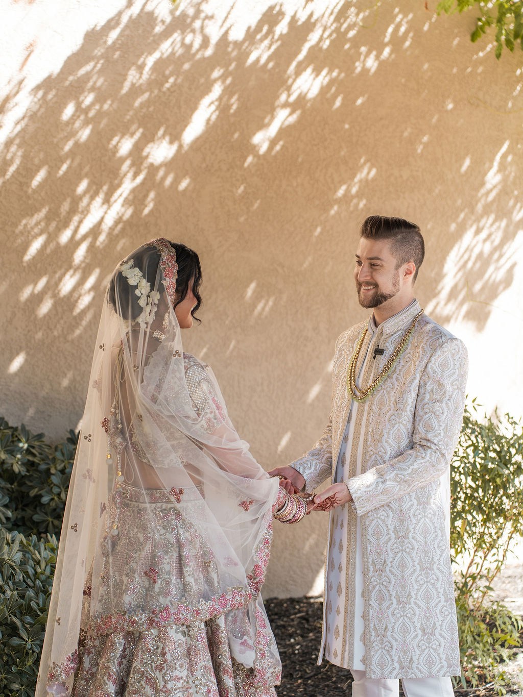 Anika and Caden together in dappled wedding-day light