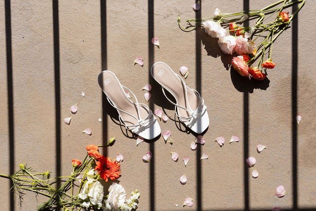 Anika’s shoes among flower petals