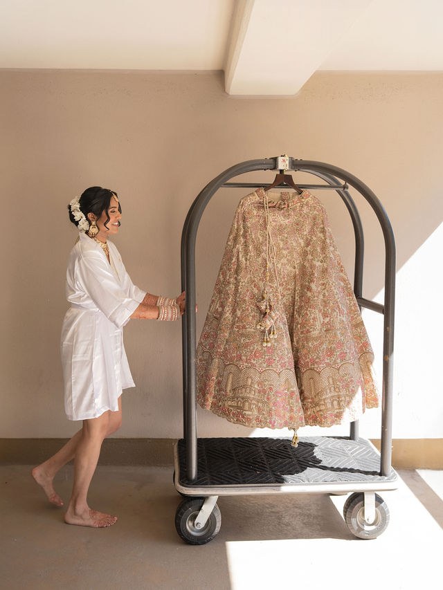 Anika beside her wedding outfit before the ceremony
