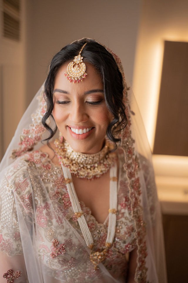 Anika smiling in her wedding attire