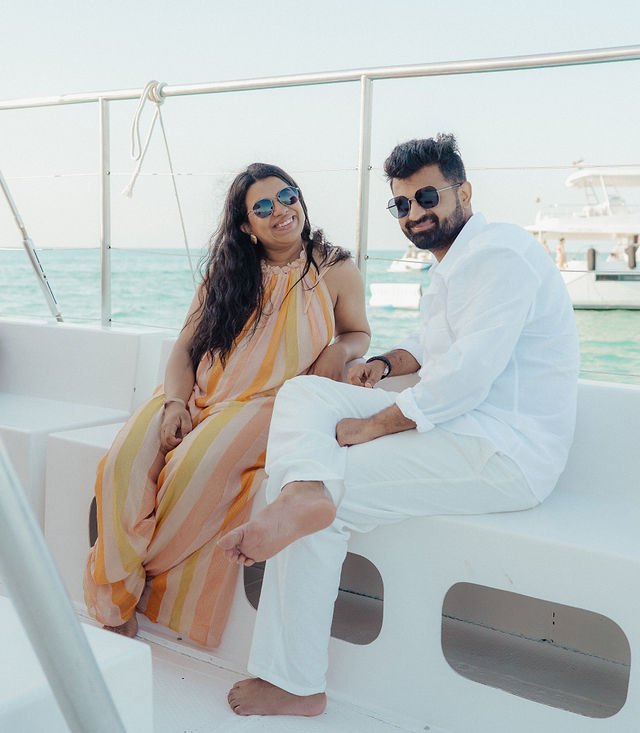 Aisha and Jiv sharing a quiet moment on a boat near Cancún