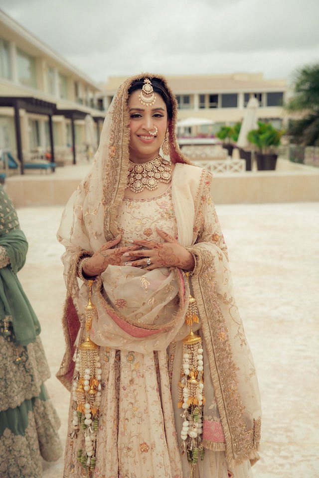 Aisha in her bridal ensemble before the Anand Karaj