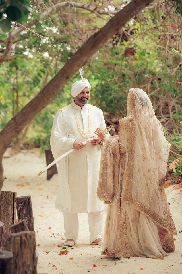 Aisha and Jiv meet beneath a canopy of trees