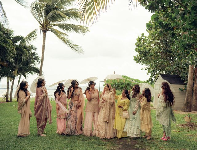 Aisha and loved ones gathered under the palms