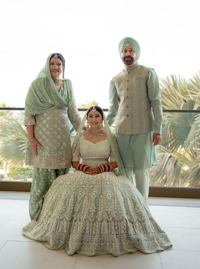 Alisha with her parents before the wedding ceremony