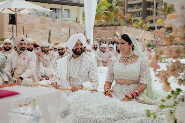 Alisha and Sean seated together during the Anand Karaj