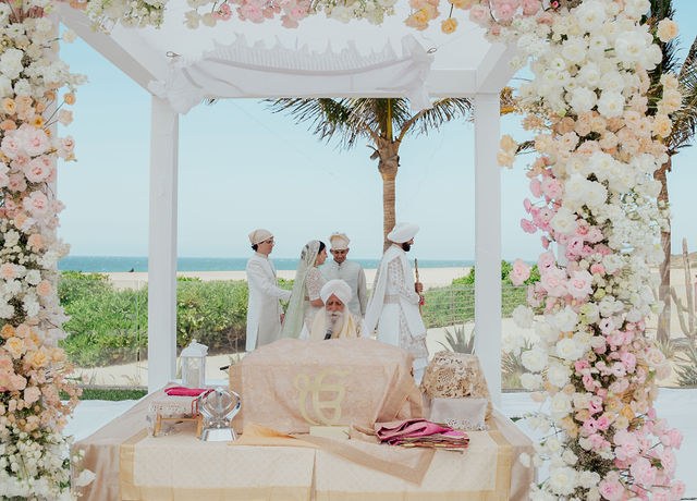 The floral ceremony canopy overlooking the Cabo coast