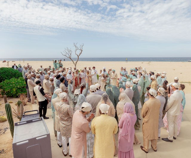 Wedding guests gathered beside the ocean