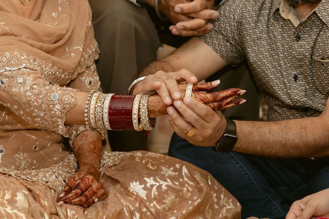 Hands joined during a family blessing