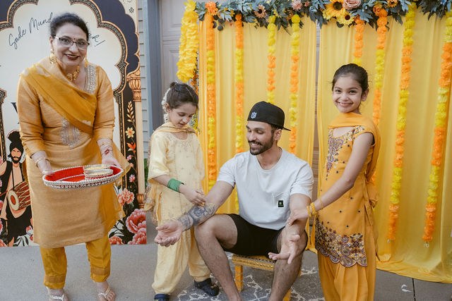 Yugraj surrounded by family during the Haldi