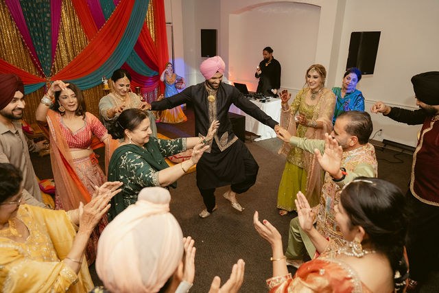 Family and friends dancing at the Jaggo