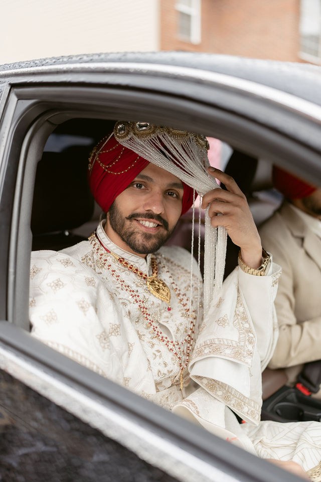 Yugraj smiling from the car on his wedding day