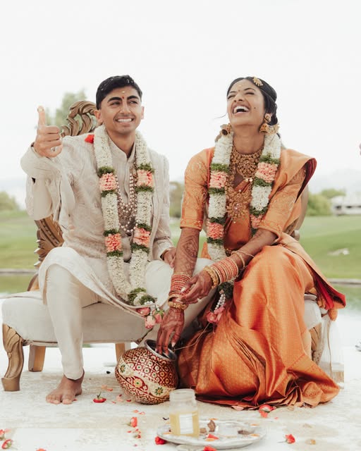 A couple laughing together during their wedding ceremony