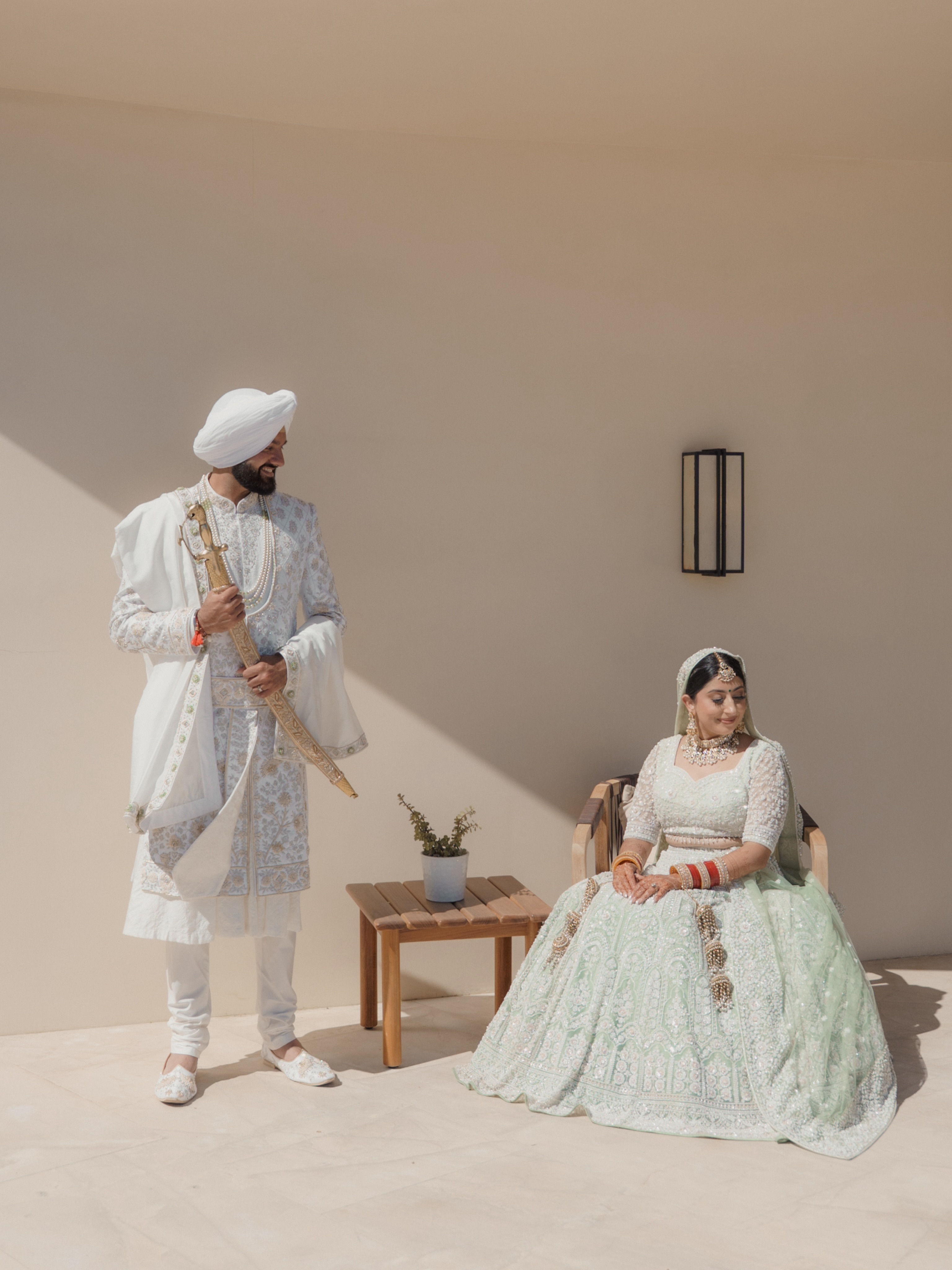Alisha and Sean in an ivory wedding-day portrait in Cabo