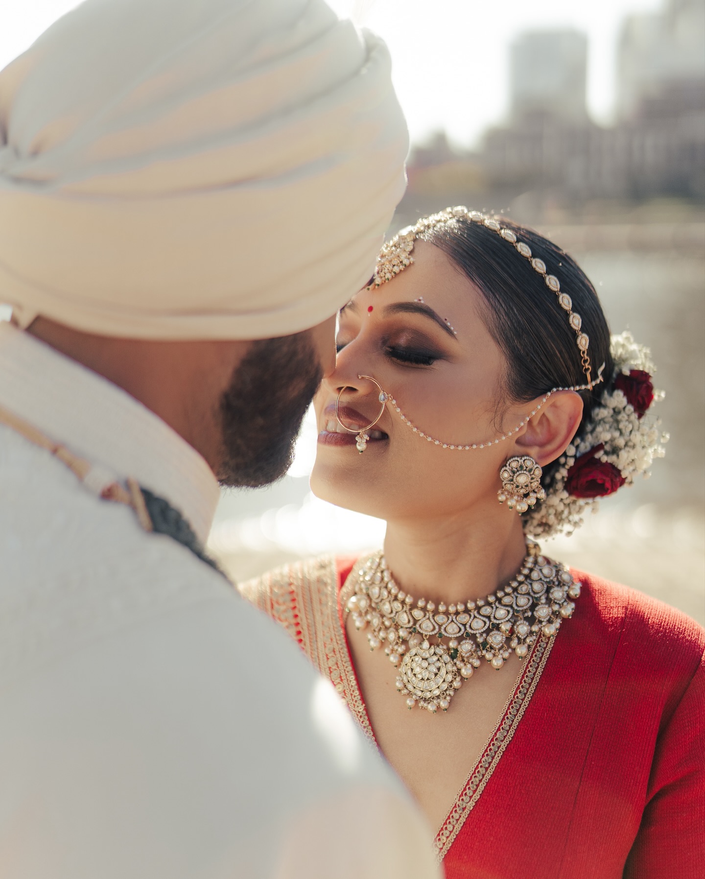 Shrusti and Rishi sharing a quiet wedding-day moment by the river