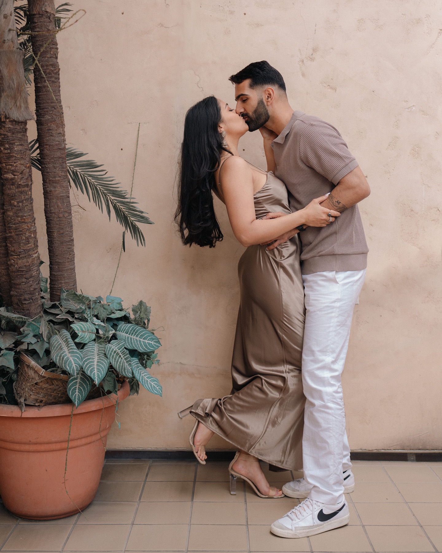 Varun and Nirali kiss during their pre-wedding portrait session