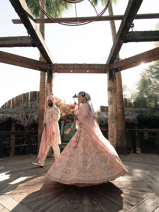 Aman’s bridal skirt moves beneath an open timber canopy