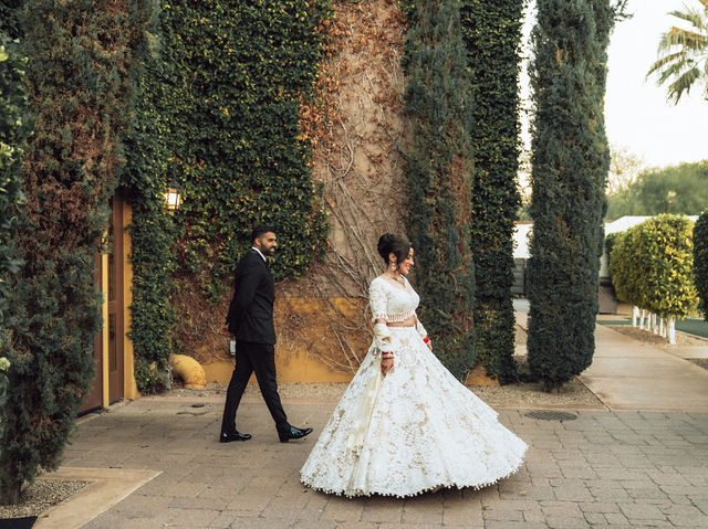 Jessey and Aman among tall garden hedges in evening attire