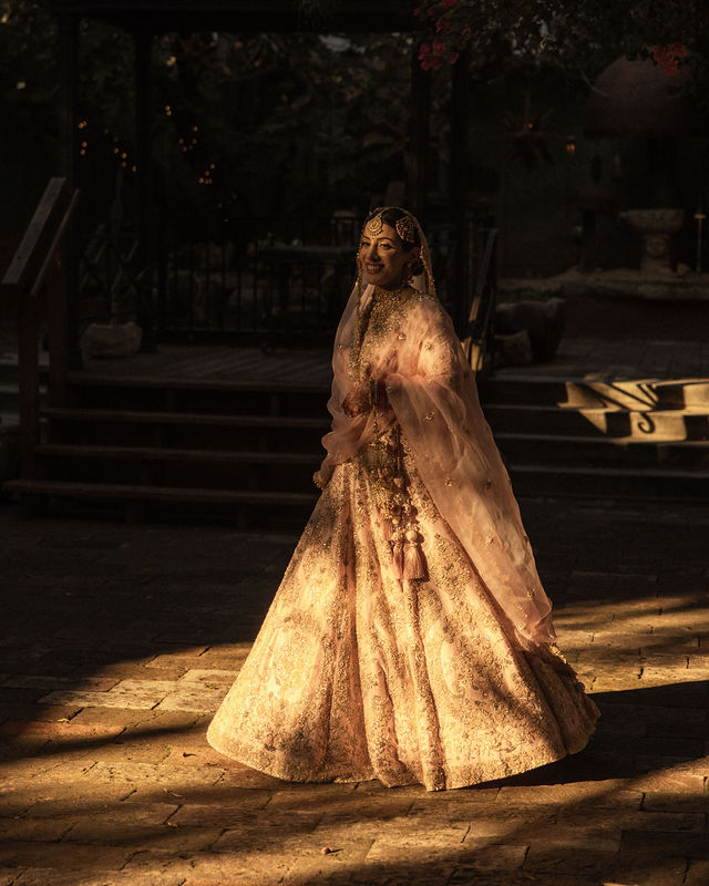 Aman in golden evening light wearing her wedding-day attire