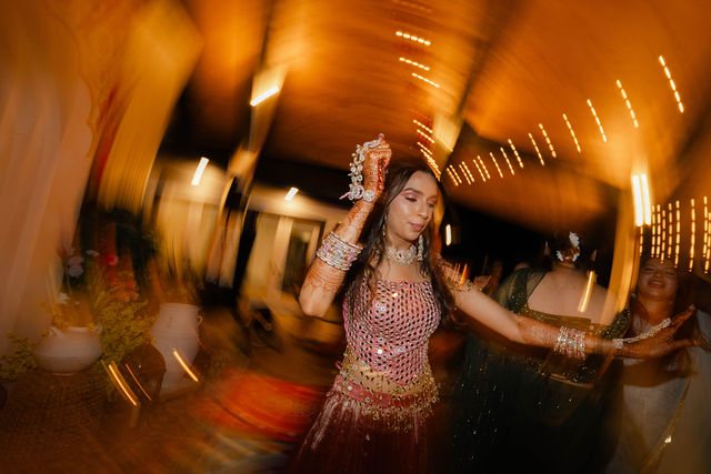 Khyati dancing beneath warm lights at the evening celebration