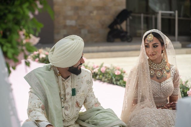Grace and Karan sharing a quiet moment during the wedding ceremony
