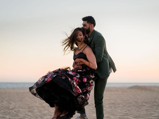 Grace’s floral dress moving in the sea breeze as Karan stands beside her