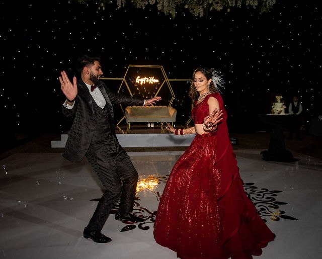 Grace and Karan dancing together at their reception