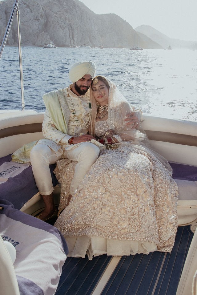 Grace and Karan embracing on the yacht