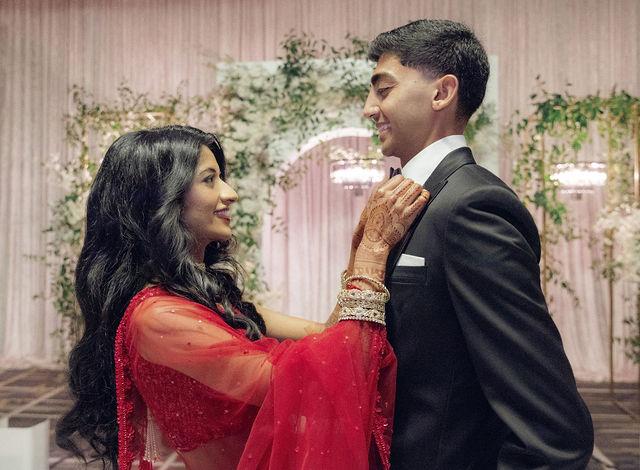 Karishma smiles at Shil during their reception portrait session