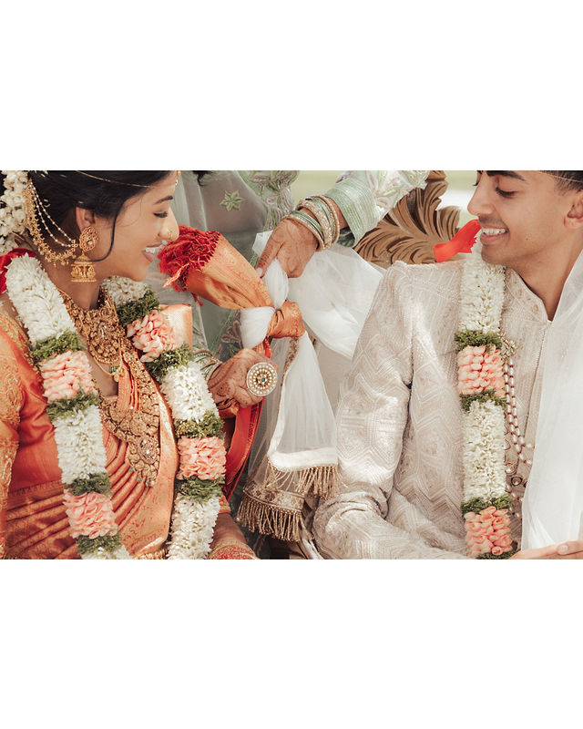 Karishma and Shil share a playful moment during the ceremony