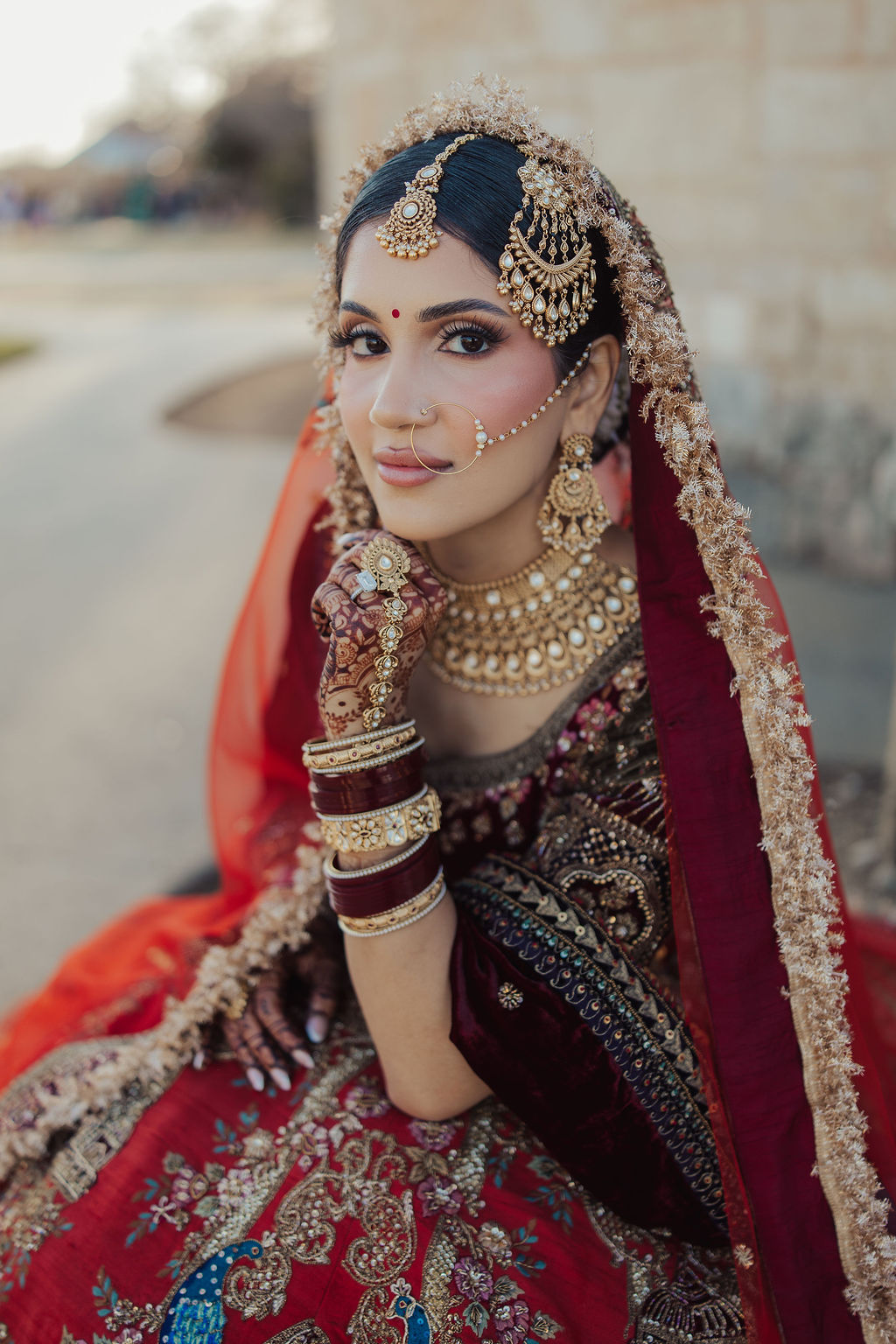 A close portrait of the bride’s jewelry and veil