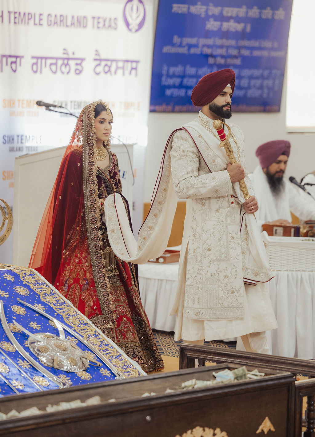 The couple walking together inside the gurdwara