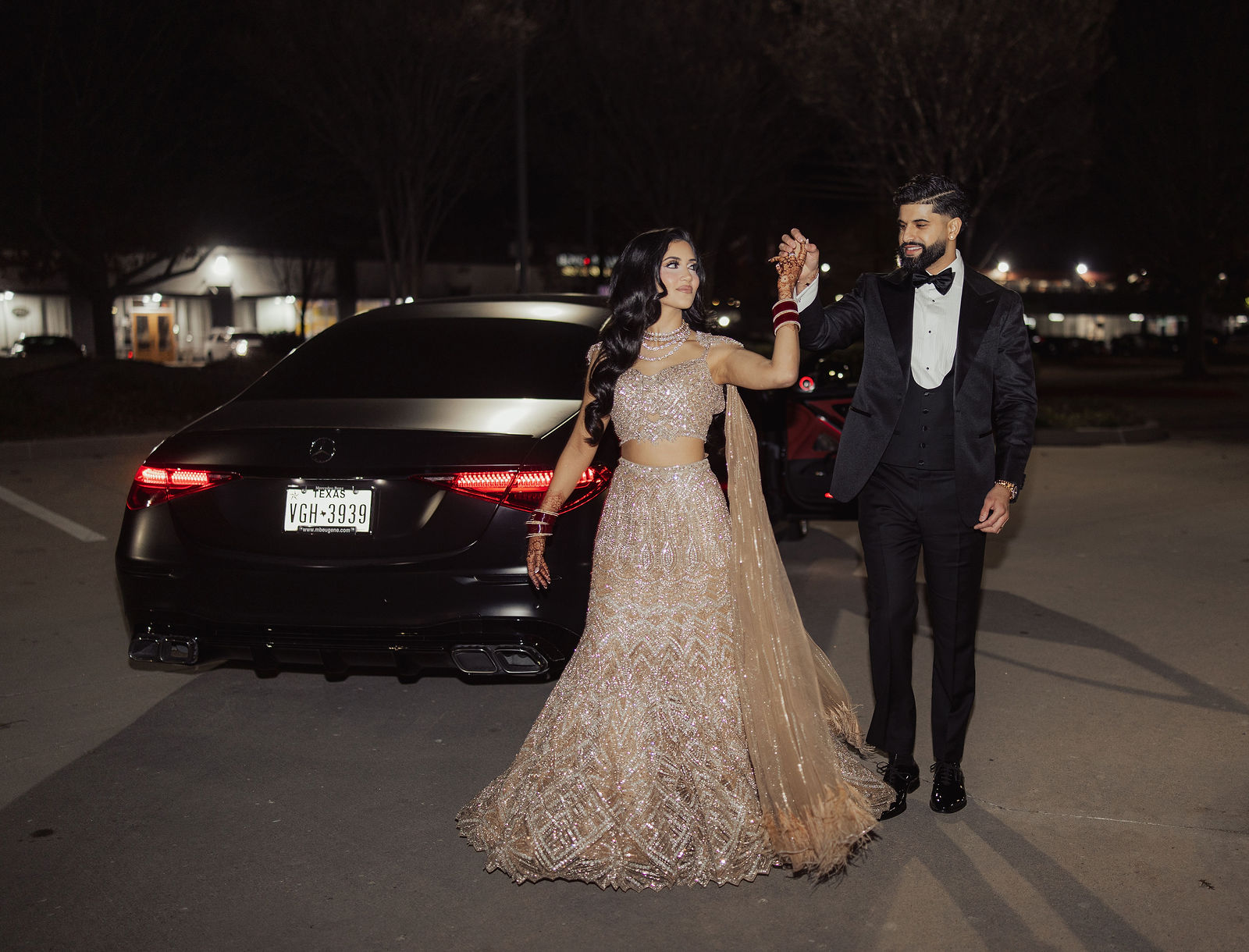 The couple walking together after their reception