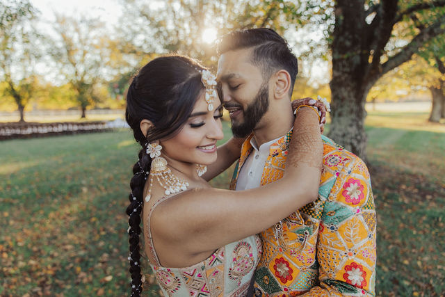 Monali and Sunny together beneath the trees before the wedding