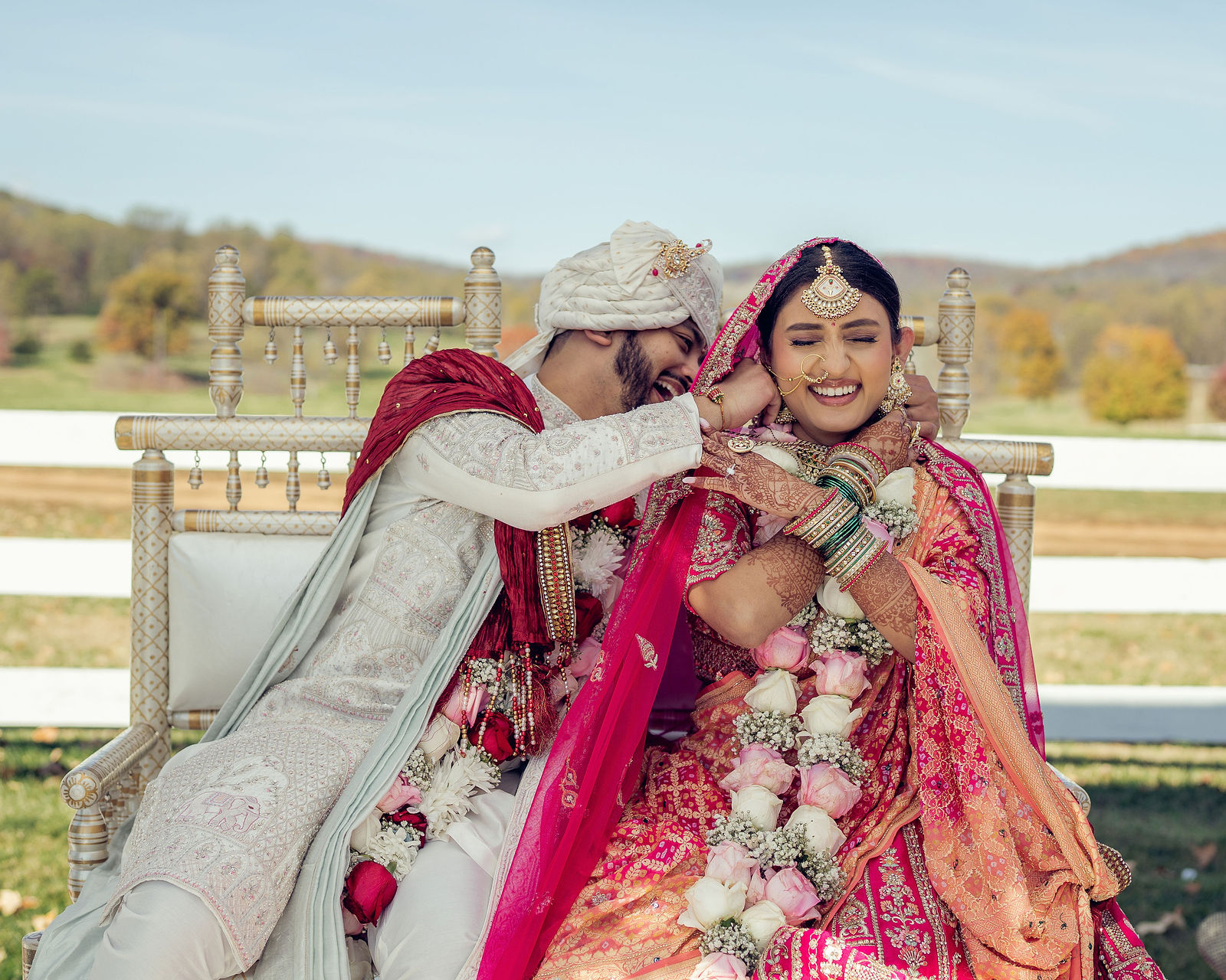 Monali and Sunny embracing beneath the mandap