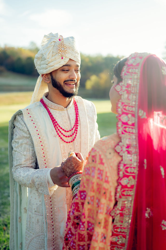 Sunny smiling toward Monali at their first look
