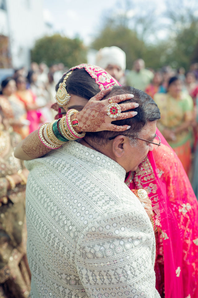 Monali embracing a family member at the wedding