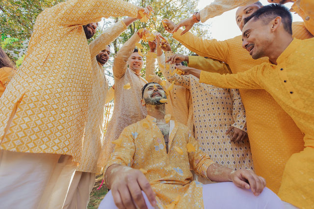 Family celebrating Sunny during Haldi