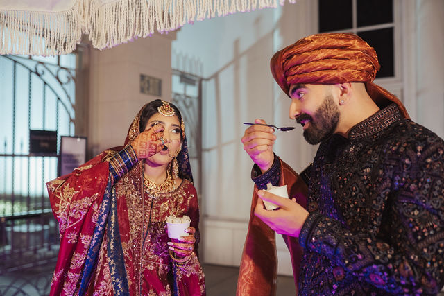 Naba and Ali sharing a light moment at the reception