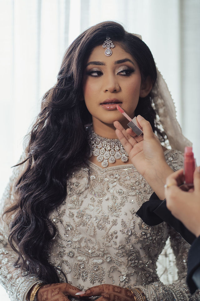 Naba in silver bridal attire during Waleema preparations
