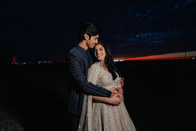 Anoop holding Rachana at sunset before their Sangeet
