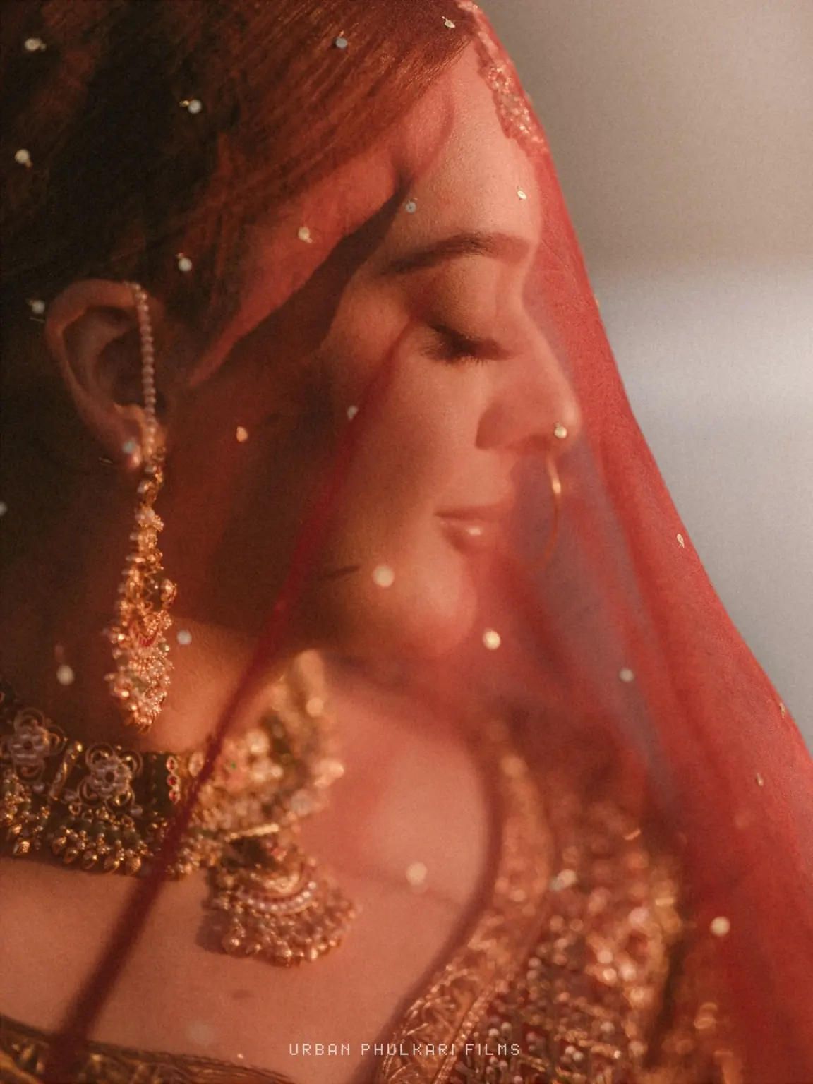 Ramandeep beneath her red bridal veil