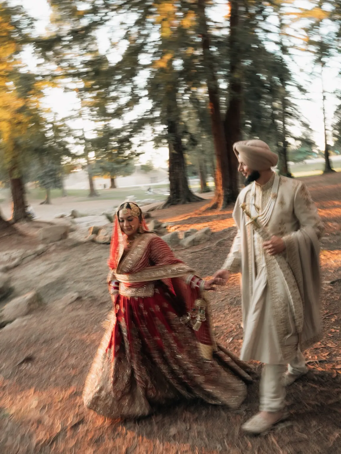 Ramandeep and Jaskaran hold hands in a portrait filled with movement