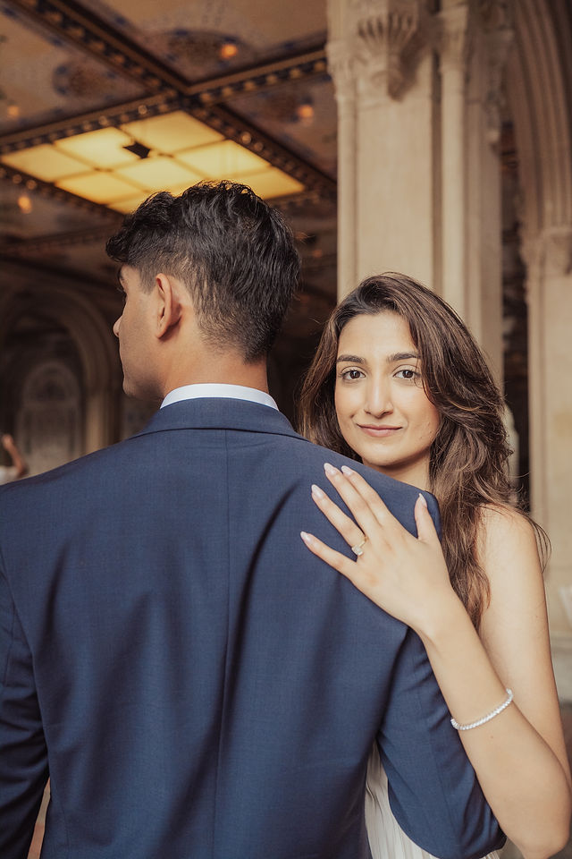 Richa looking toward the camera over Shahil's shoulder