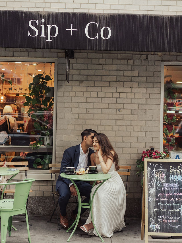 Richa and Shahil seated together outside a neighborhood café