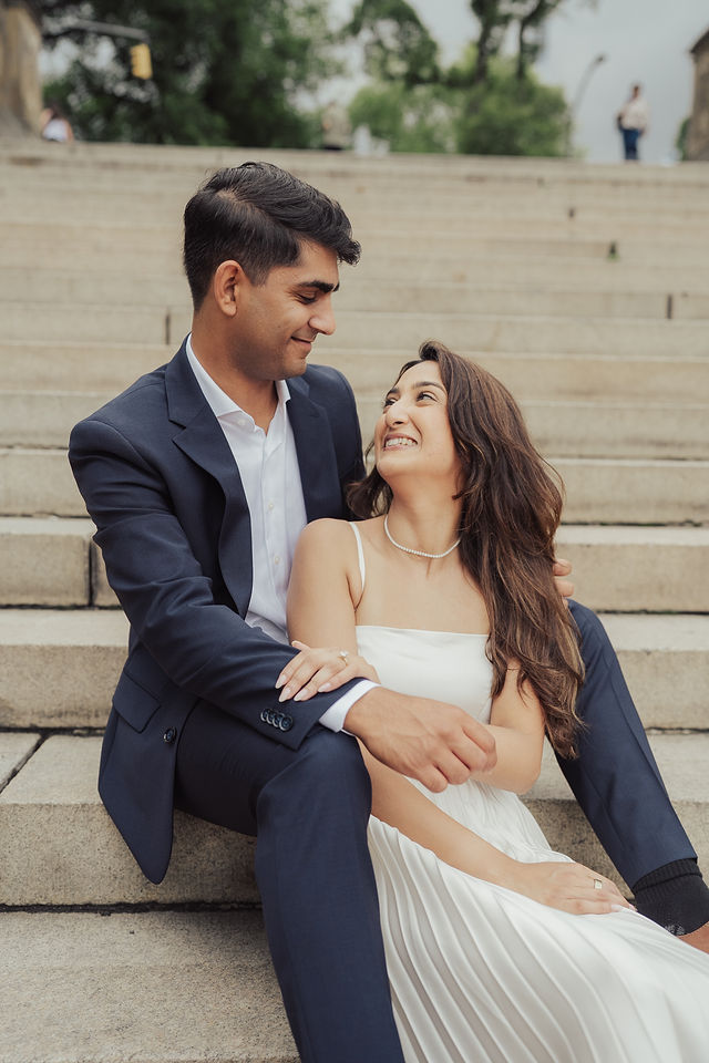 Richa and Shahil in a close portrait on the park steps