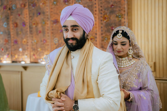 Sakhi and Amitoj seated together during their Anand Karaj