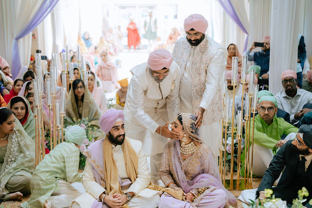 Sakhi and Amitoj taking part in their wedding ceremony