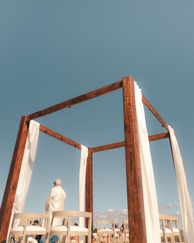 The mandap against a clear blue Arizona sky