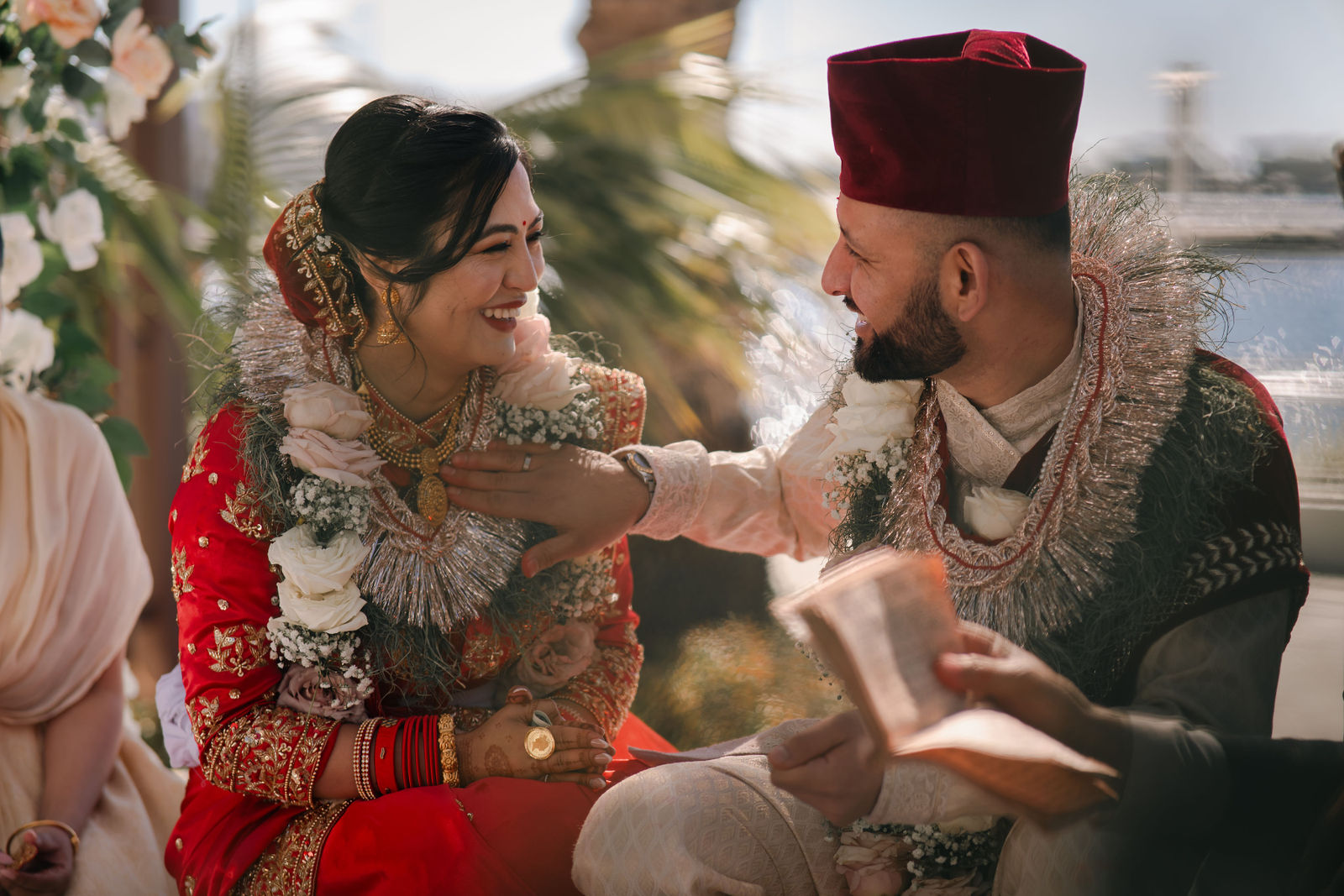 Shayal and Anup smiling together during their ceremony